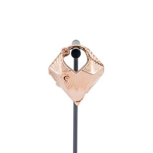 A single rose gold plated weight in a diamond shape with a laser etched geometric pattern on the outside.